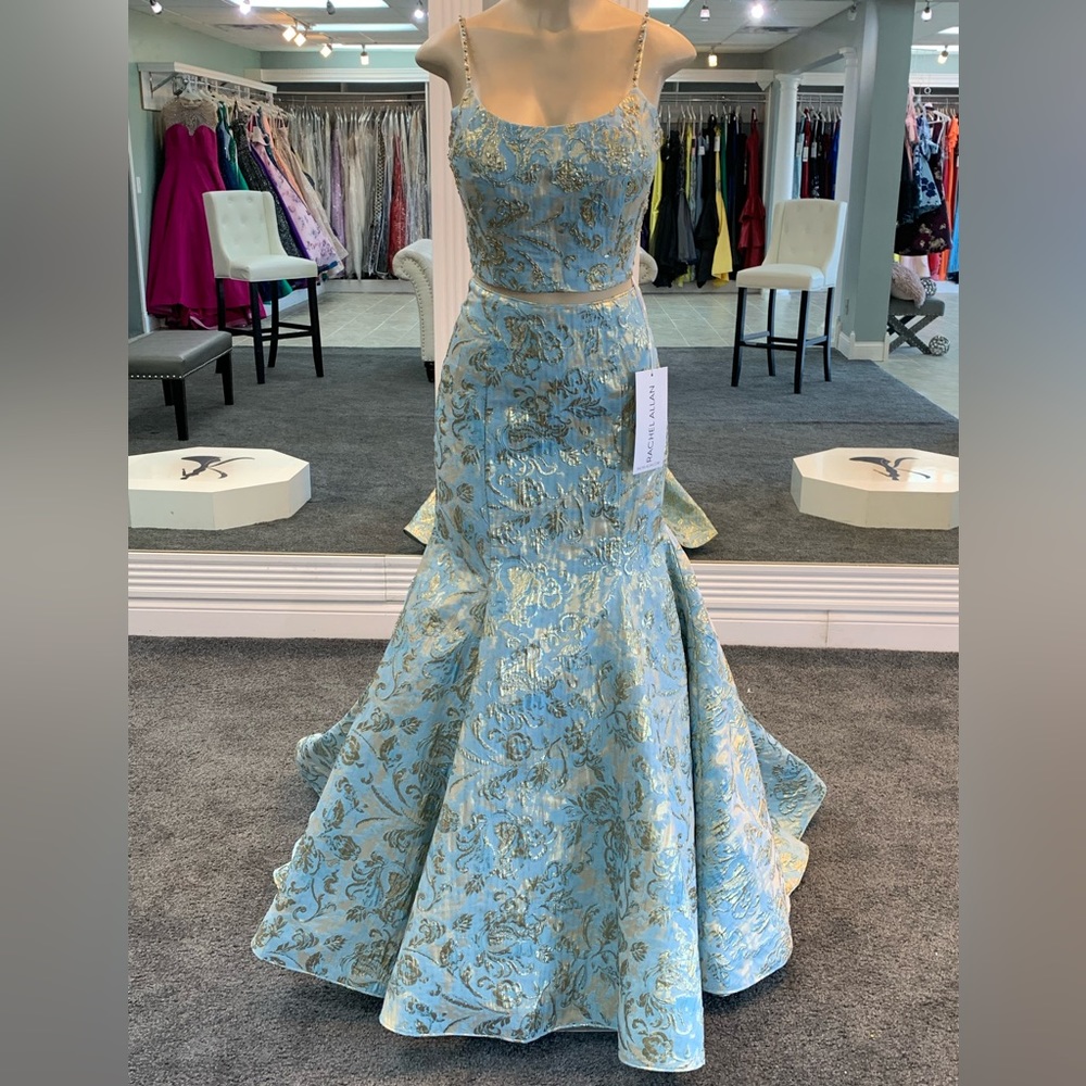Size 8. 2 piece. aqua colored. mermaid gown.